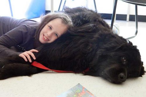 Kaleigh McKenna snuggles up to Chiclet. Photo by Adrienne Decou